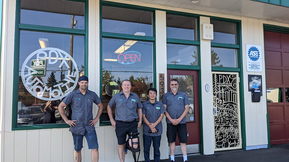 PDX Automotive group picture in front of shop